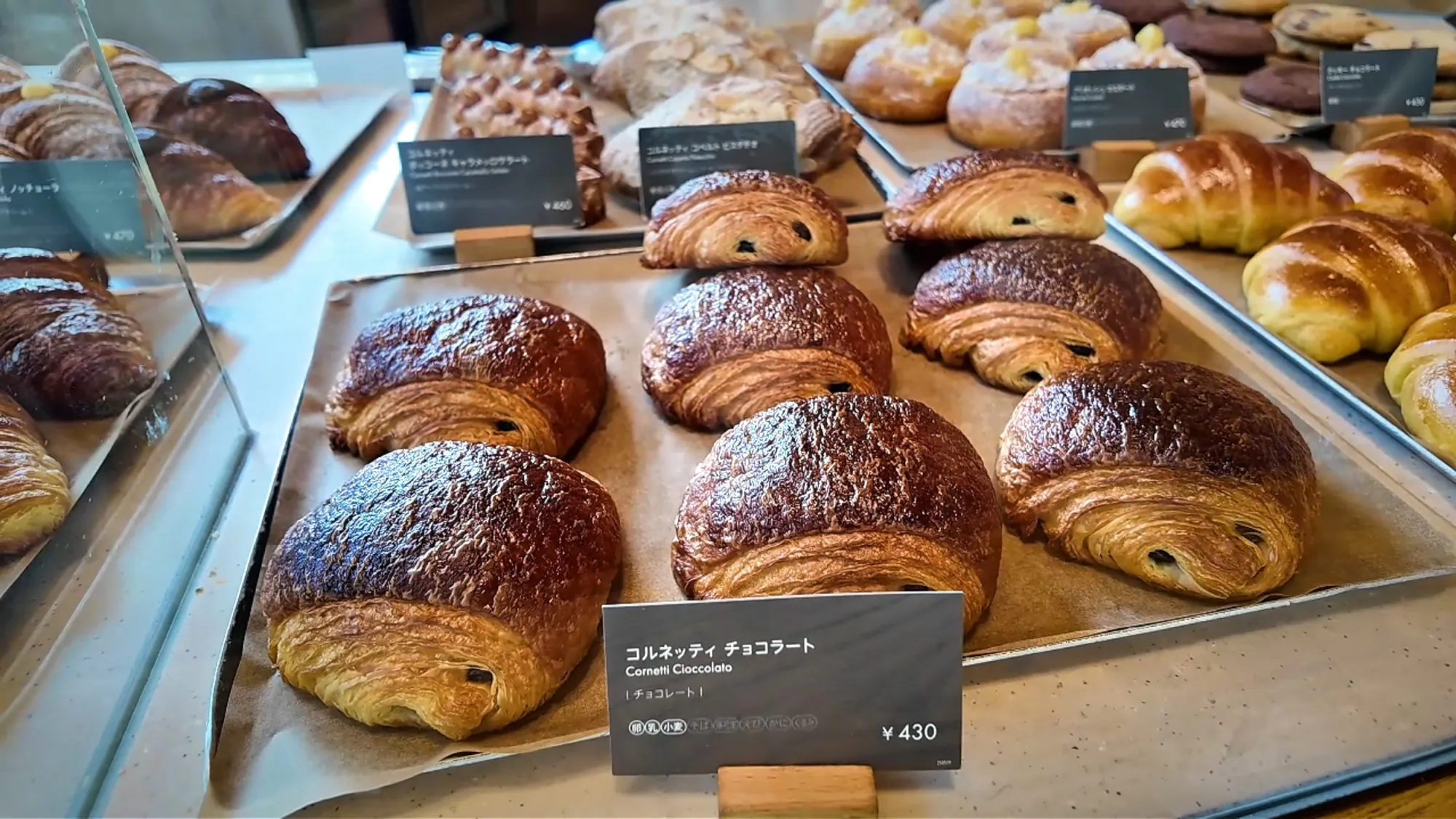 Trays of chocolate cornetti and other Italian pastries at the Princi counter in Starbucks Reserve Roastery Tokyo.
