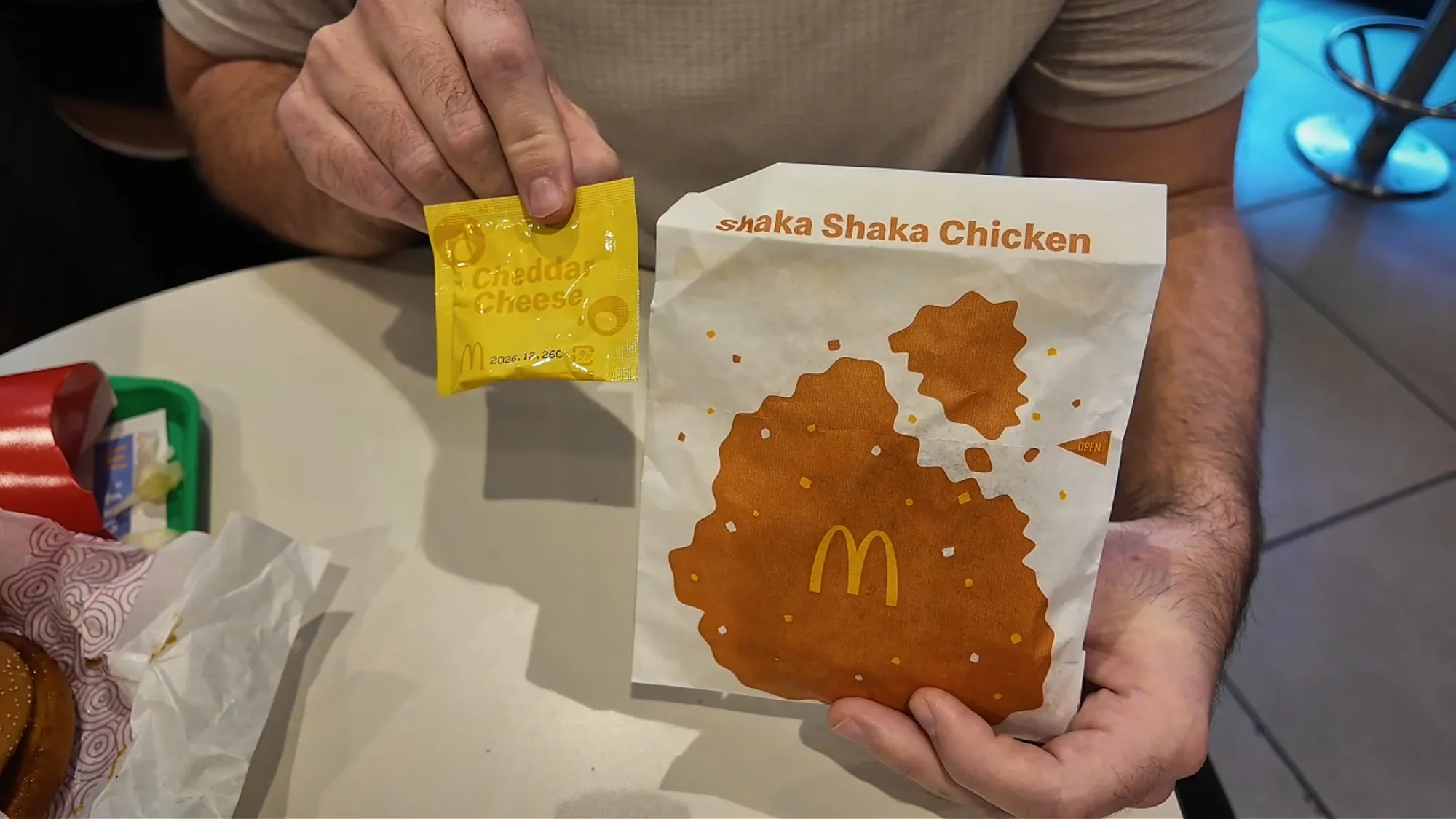 A Shaka Shaka Chicken bag and its cheddar cheese seasoning packet at McDonald's in Japan.