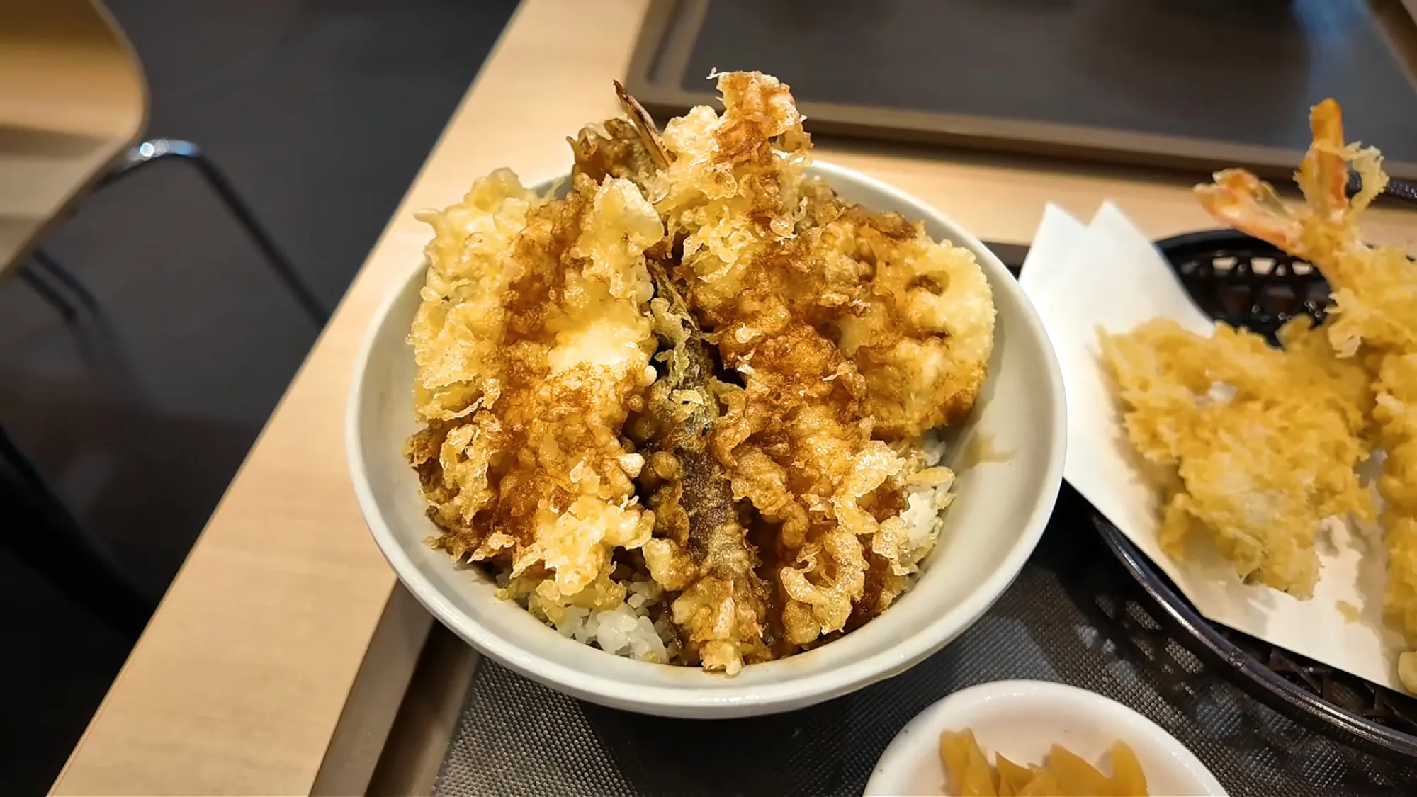 A Tenya tendon bowl piled with shrimp and vegetable tempura over rice
