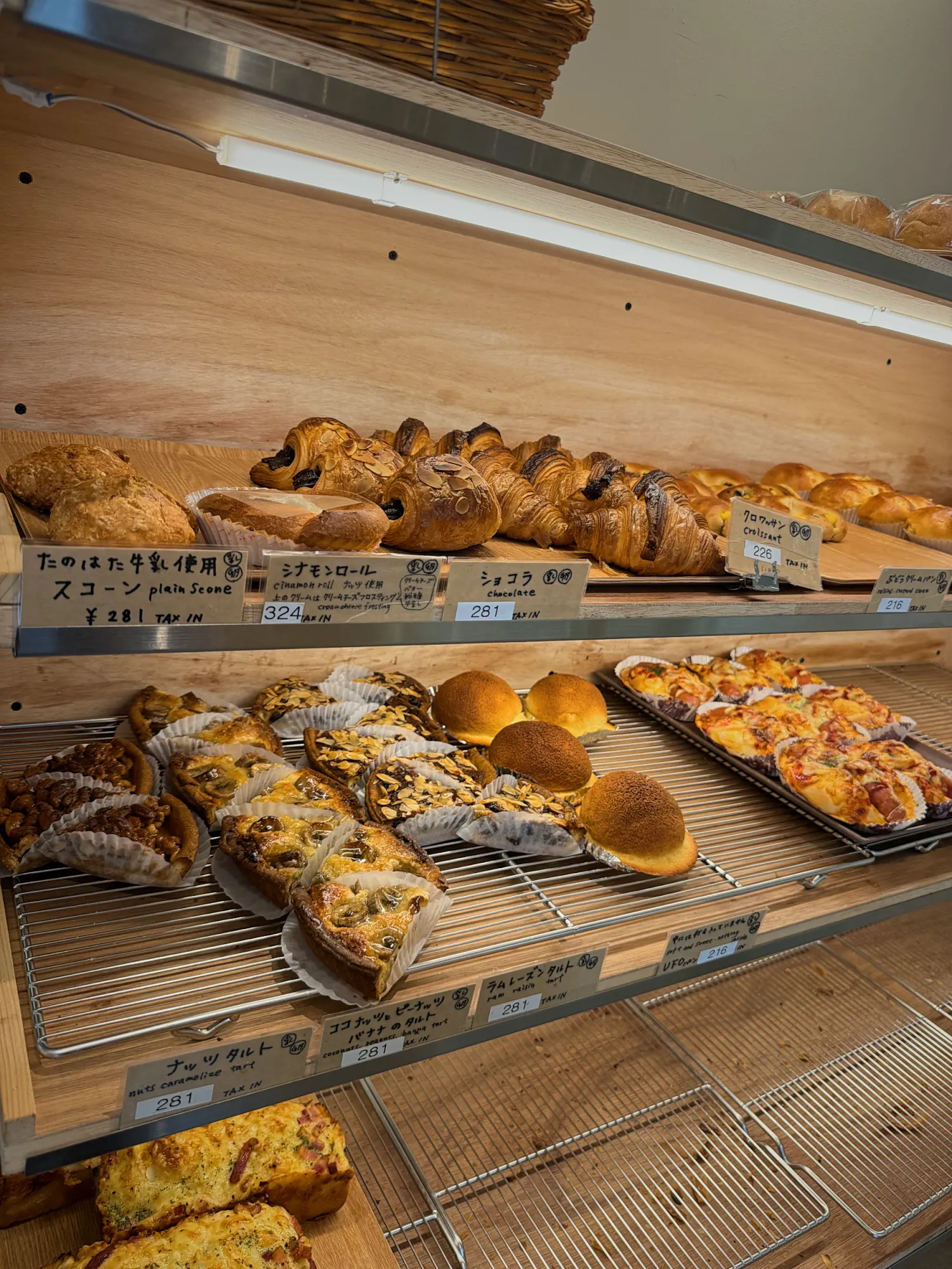 Shelves of buns and pastries inside Donsuke Bakery