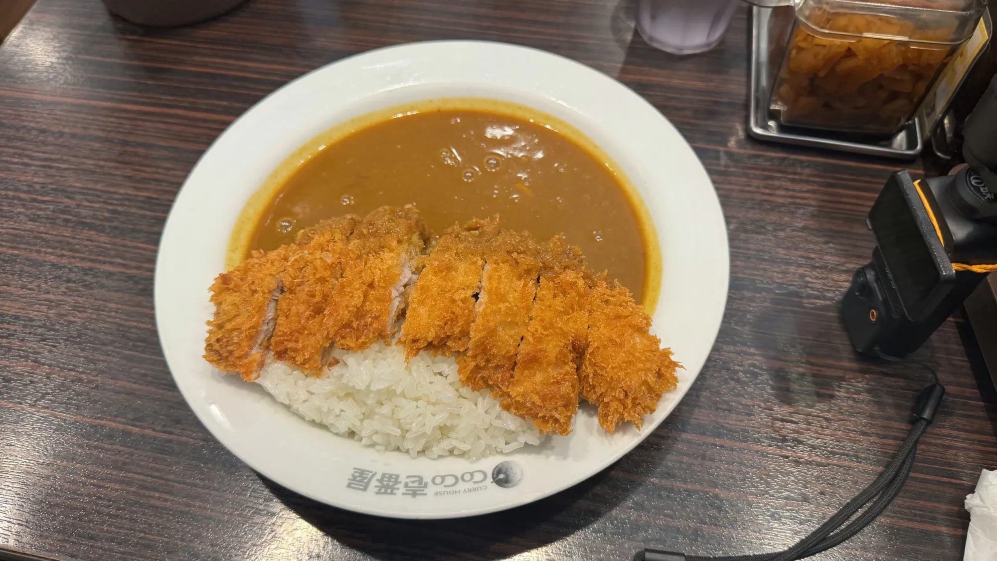 A plate of Japanese curry with a crispy chicken cutlet over white rice at CoCo Ichibanya in Tokyo.