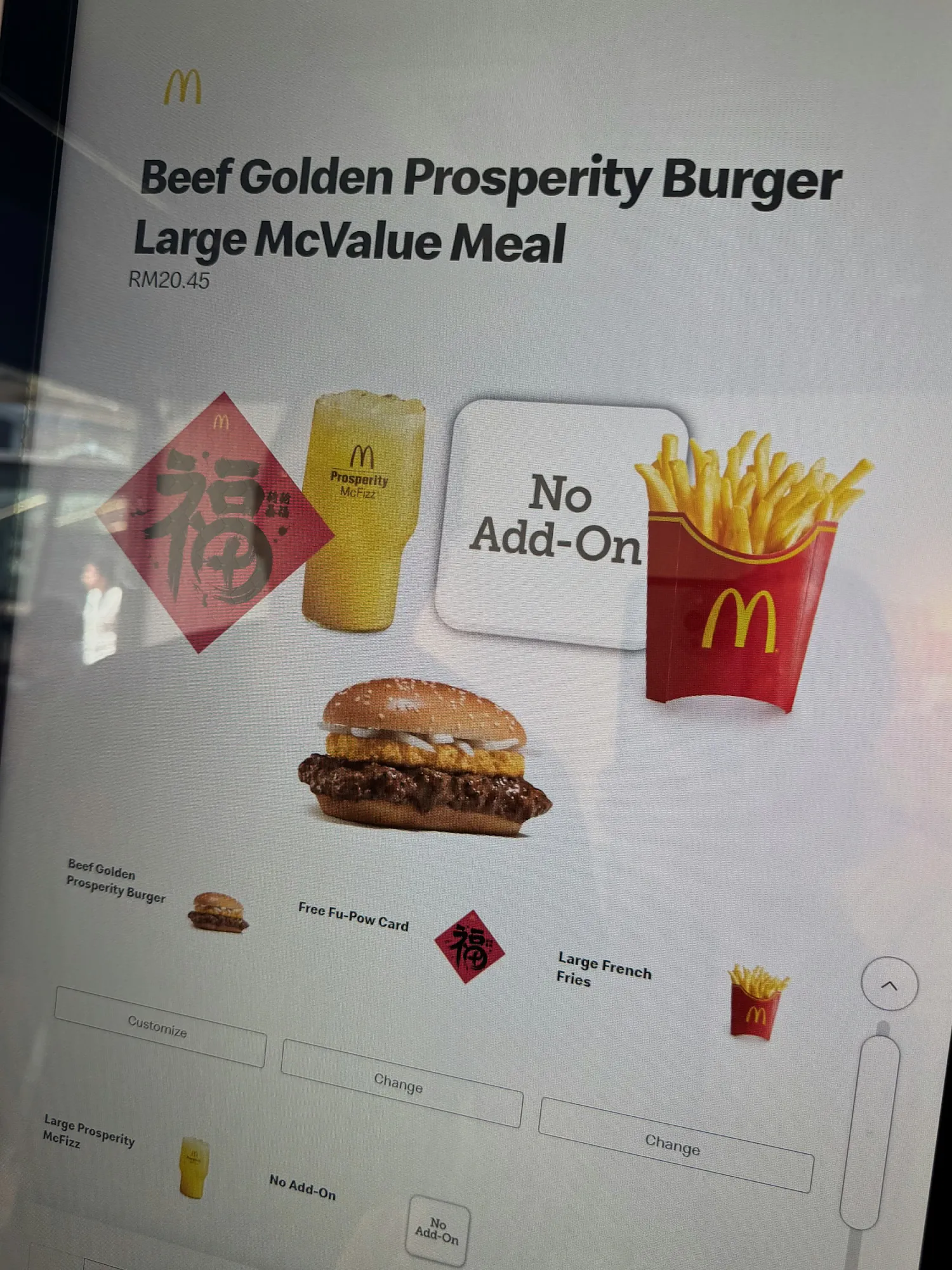 A McDonald's ordering kiosk showing the Beef Golden Prosperity Burger Large McValue Meal in Kuala Lumpur.