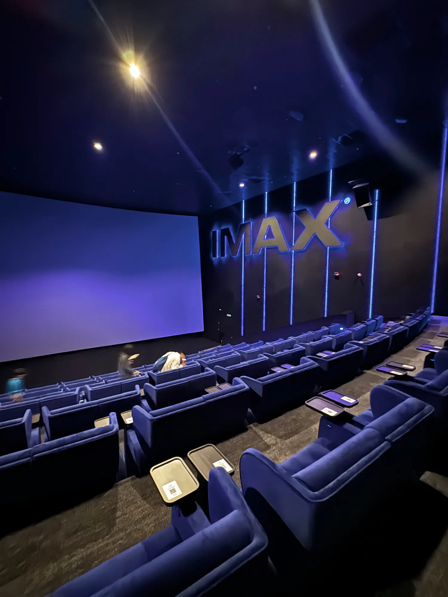 Rows of blue velvet recliners facing the IMAX screen at Aurum Theatre, The Exchange TRX.