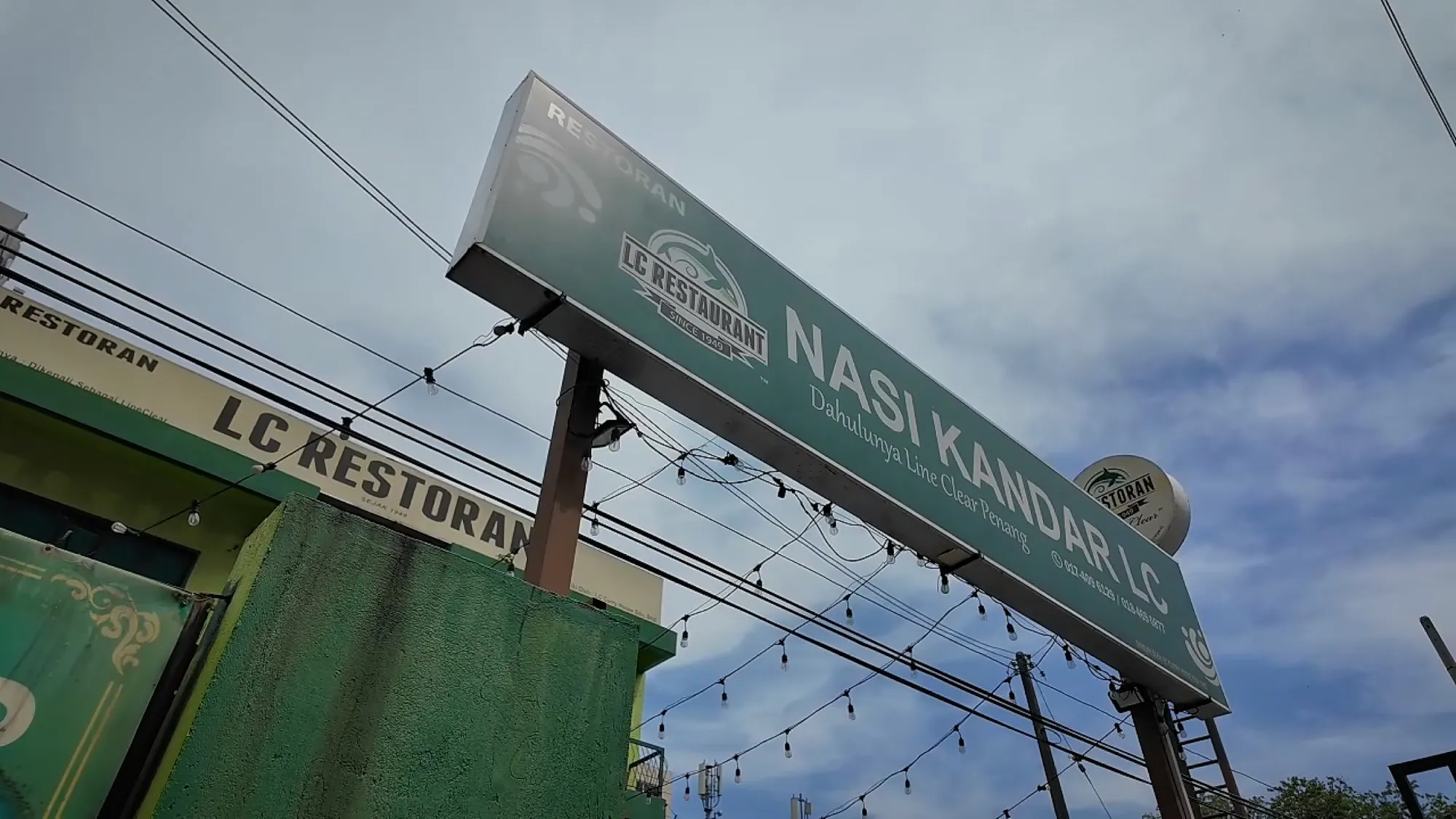 The LC Restoran Nasi Kandar sign over the Line Clear shop in Kampung Baru, Kuala Lumpur