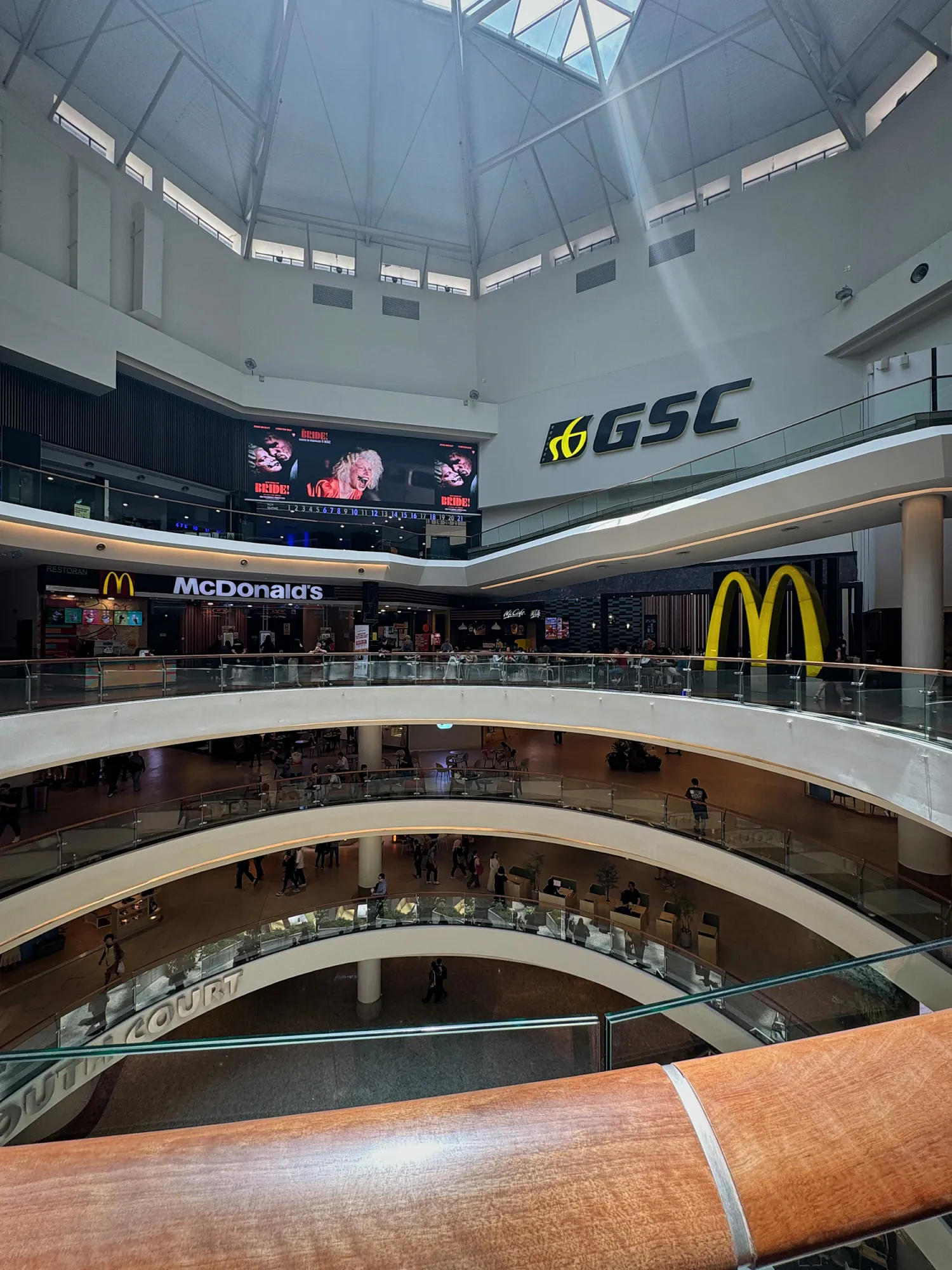 Looking across the multi-level atrium of Mid Valley Megamall in Kuala Lumpur, with the GSC cinema sign on an upper floor.