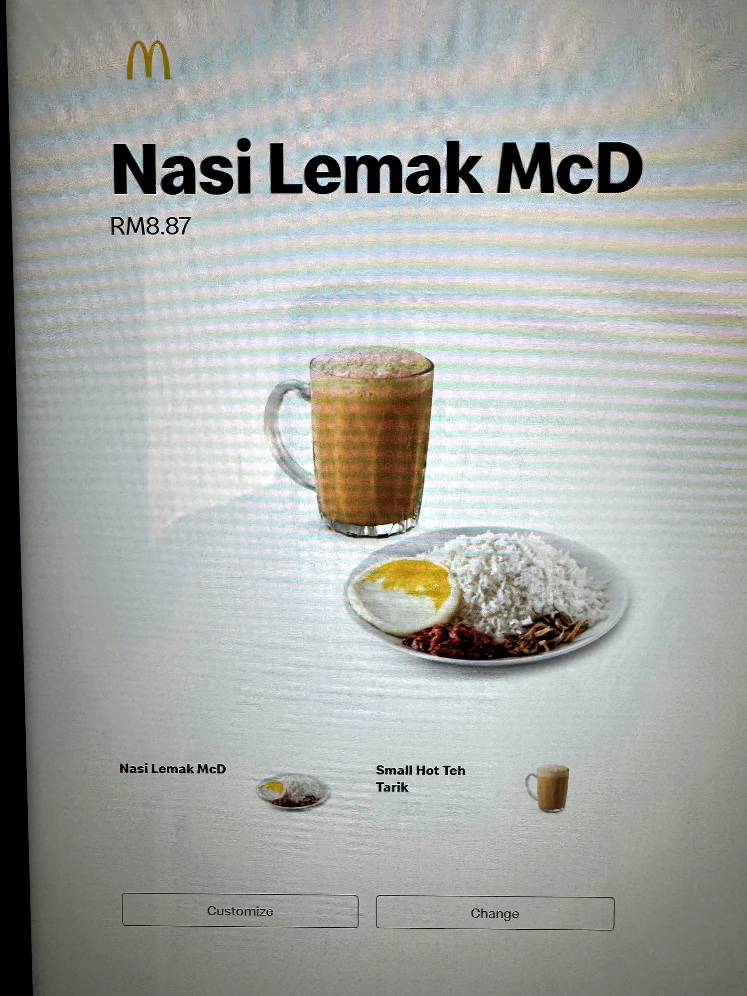 A McDonald's self-order kiosk in Bukit Bintang, Kuala Lumpur, showing a Nasi Lemak McD combo with Teh Tarik in English.