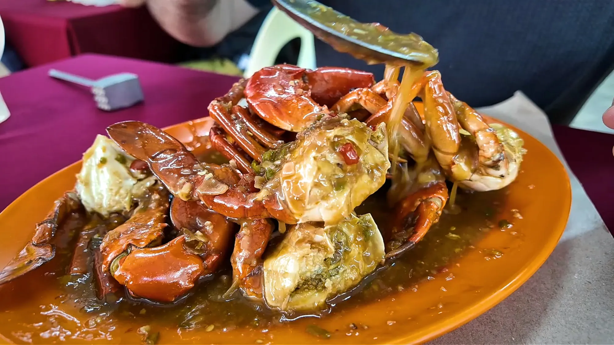 A plate of whole crabs in thick sweet and sour chilli sauce at Restoran Fatty Crab in Taman Megah, Petaling Jaya.